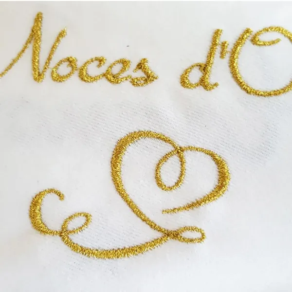 Serviette de table noces d'or brodée au fil d'or